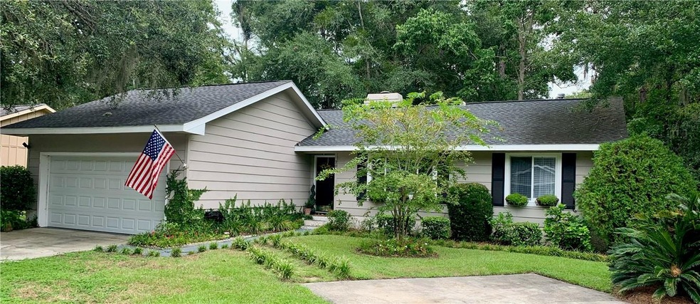 Front entrance, with a larger garage and two car p