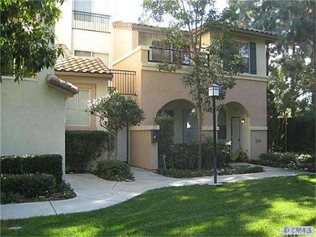 Front door & second floor patio open up to a semi-