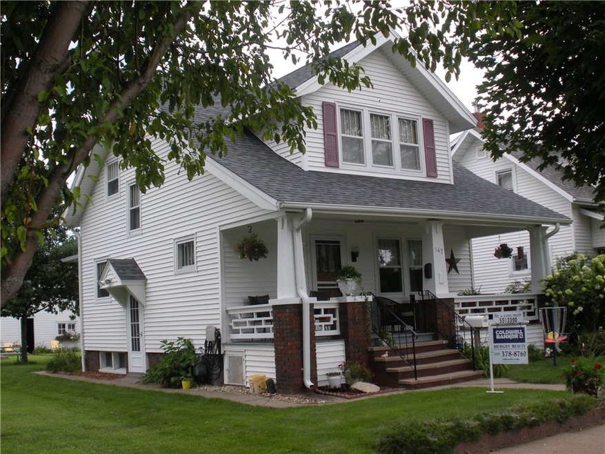Fresh vinyl siding and wide gutters.