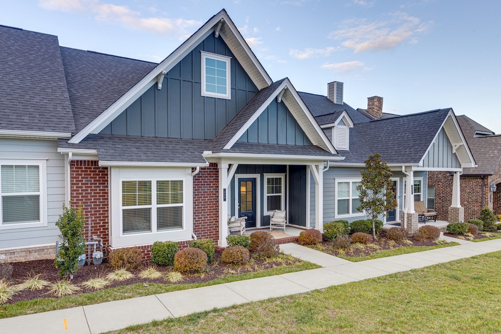 836 Cottage House Ln welcomes you with a wide front porch