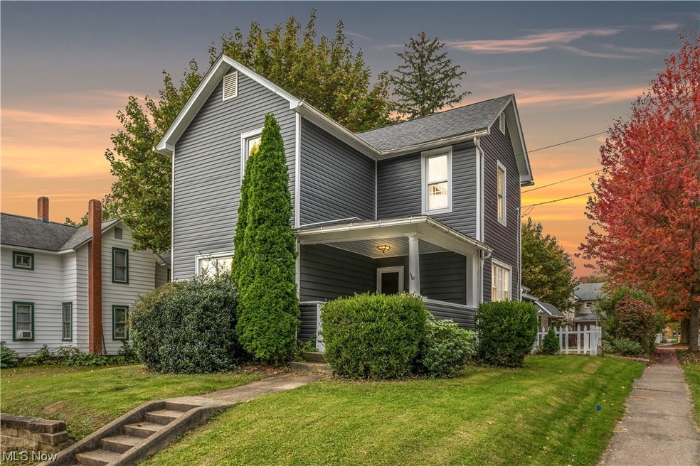 View of front of property with a yard