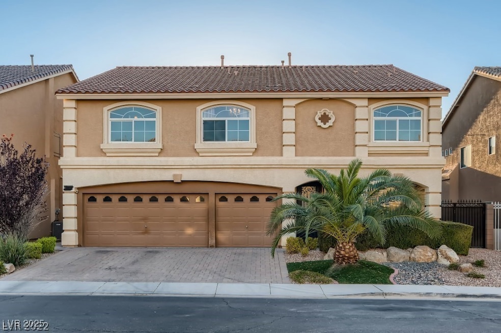 View of front facade featuring stucco siding, driv