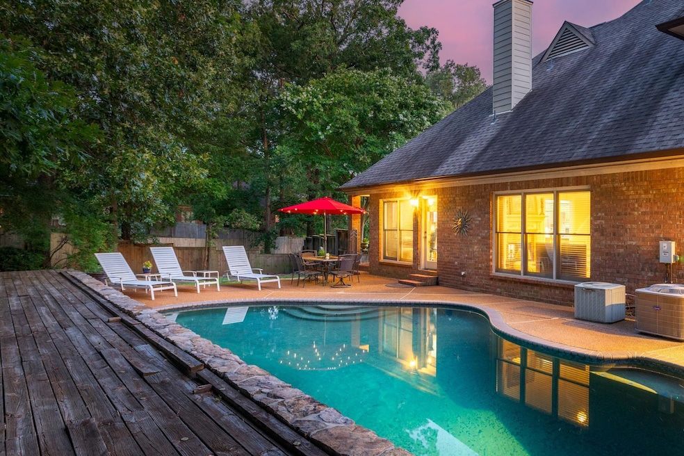 View of pool with entry steps, a deck, and outdoor dining area