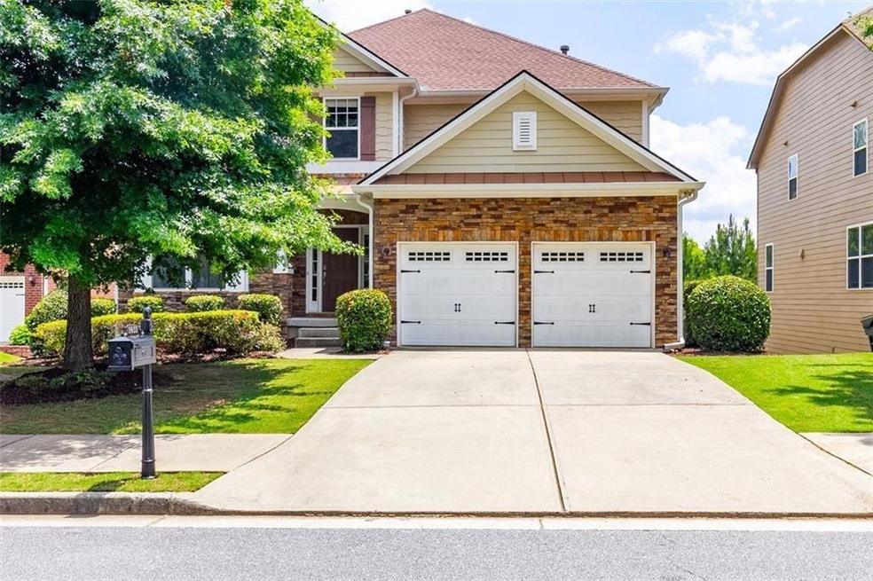 Craftsman-style house featuring a garage and a fro