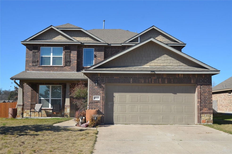 Craftsman inspired home with brick siding, driveway, roof with shingles, and an attached garage