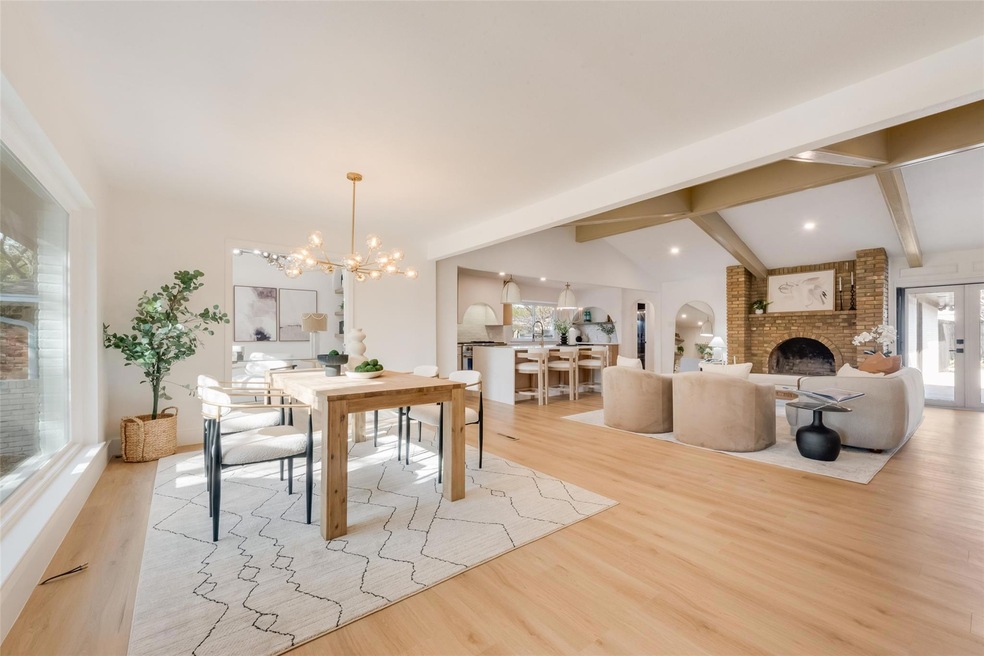 Dining area with lofted ceiling with beams, wood f