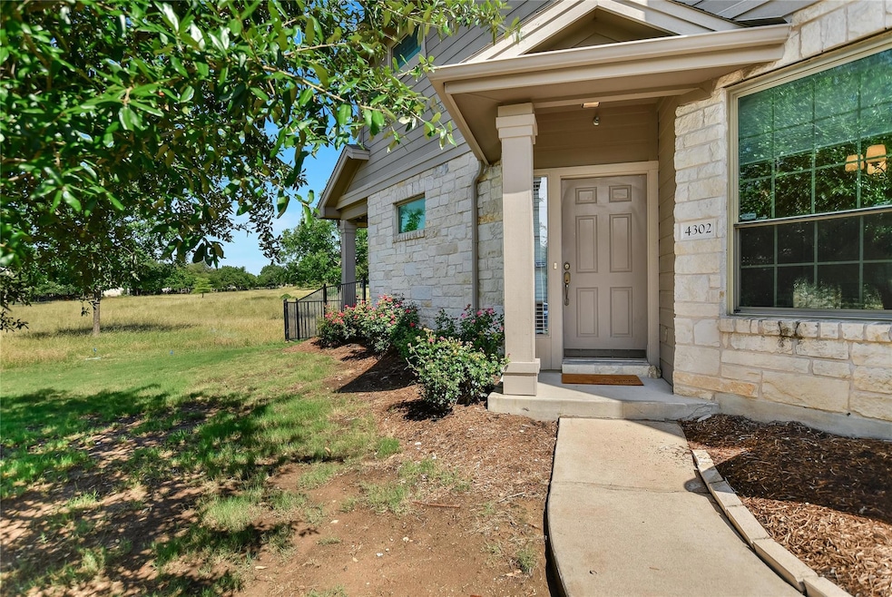 Doorway to property with stone siding