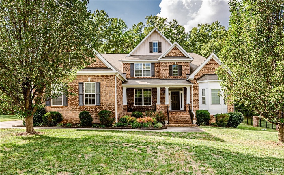 Craftsman inspired home with a front yard