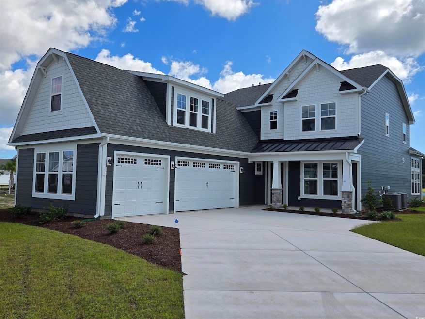 Craftsman house featuring concrete driveway, roof with shingles, central AC unit, and covered porch
