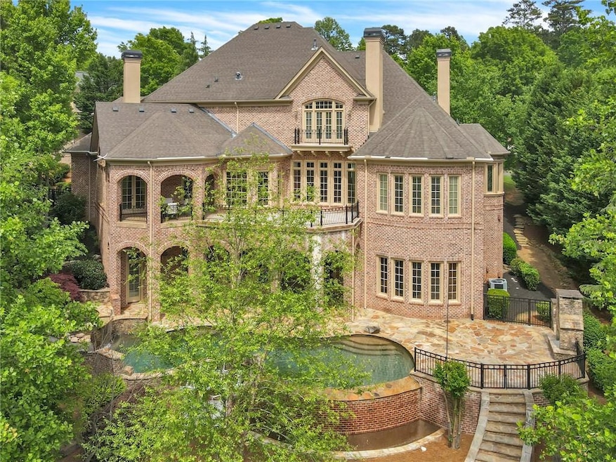 Back of property with a patio and a pool