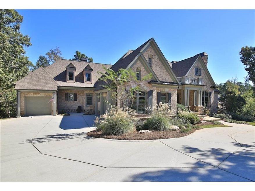 Greeted by exterior elegance, this property offers a circular driveway.