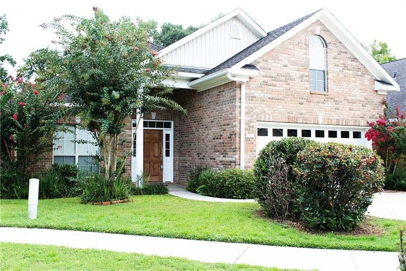 This custom built brick patio home is tucked away 