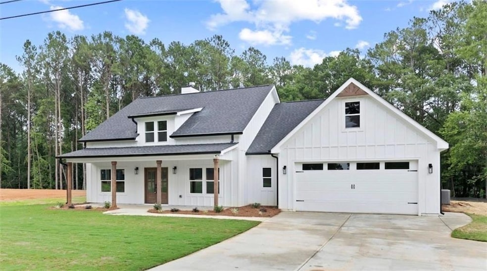 Modern inspired farmhouse featuring a porch and a 