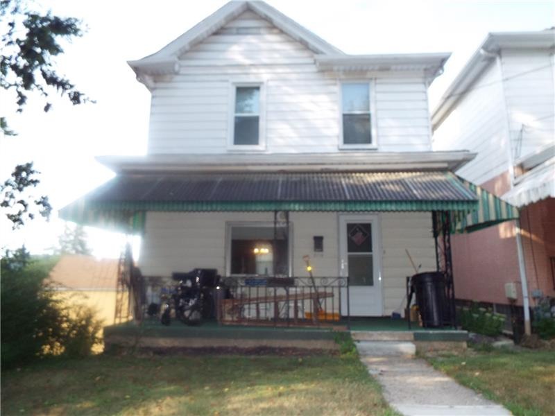 3 bedroom 2 bath home features a covered front por