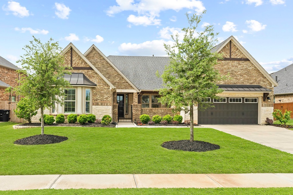 Located towards the end of a quiet street, discover this extraordinary picture-perfect 1-story home designed for the discerning Buyer. Architectural details start from the exterior and extend inside. Notice the charming Courtyard entrance, the metal awning above the garage and the use of only brick and stone that surrounds the entire home.