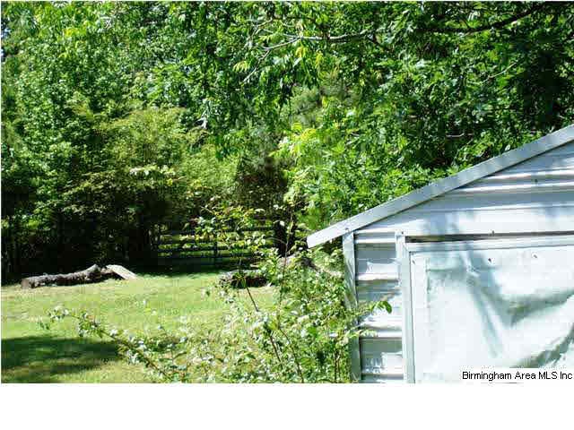 Storage and fence entering pasture