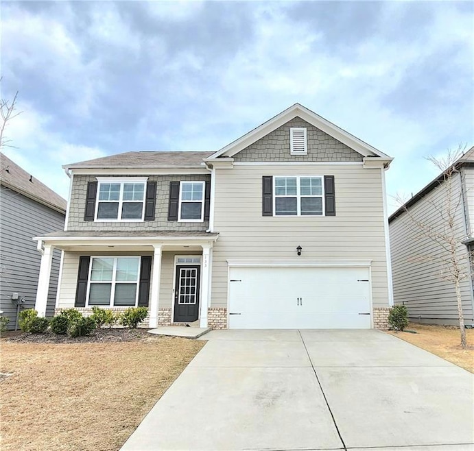 View of front of property featuring a garage