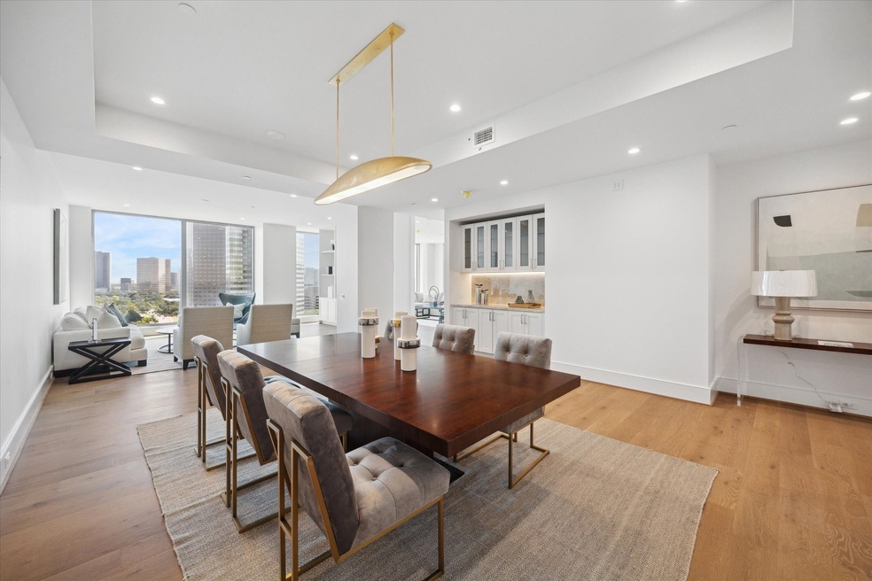 Ideal for hosting, this expansive dining room offe