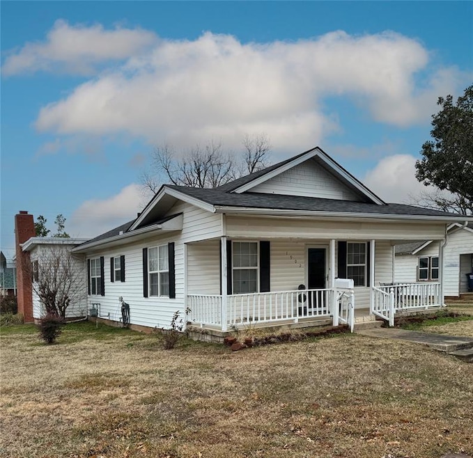 View of front of home with covered porch, a front 