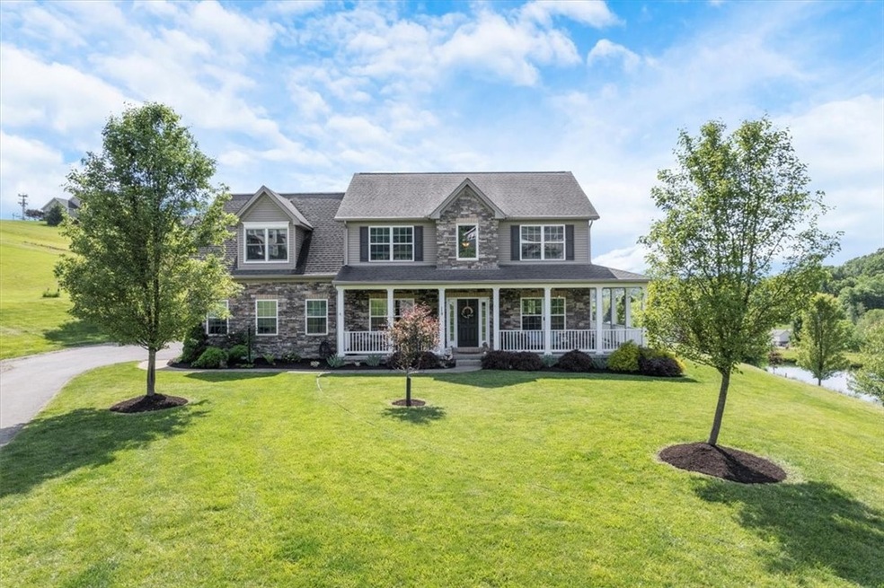 stunning custom home with wrap around porch