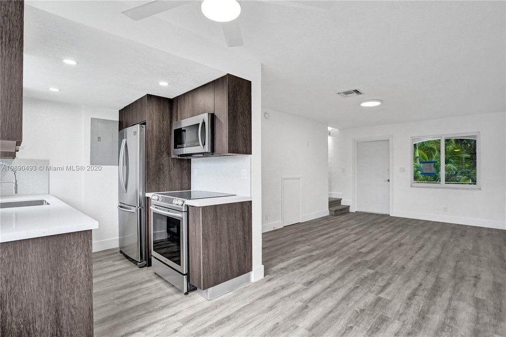 New fully loaded kitchen with quartz counter and Samsung stainless steel appliances.