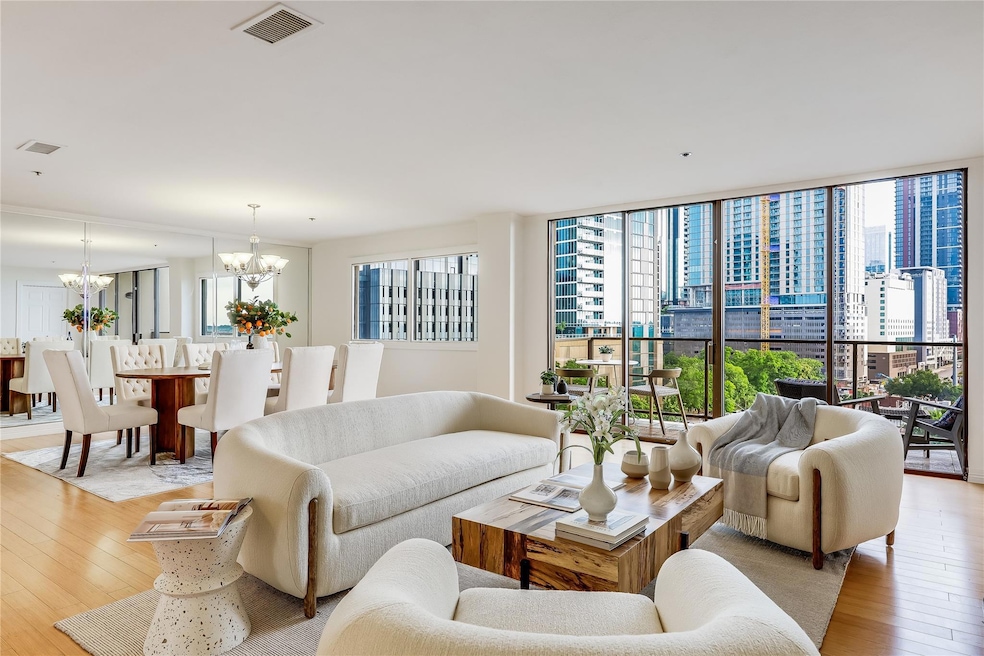 Living room with an inviting chandelier, light wo