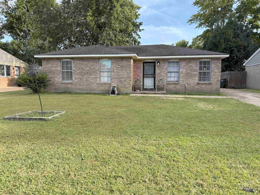 Ranch-style house featuring brick siding