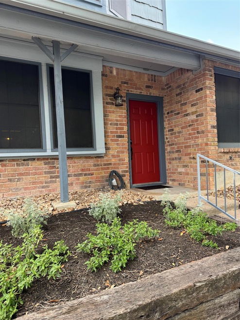 Property entrance with brick siding