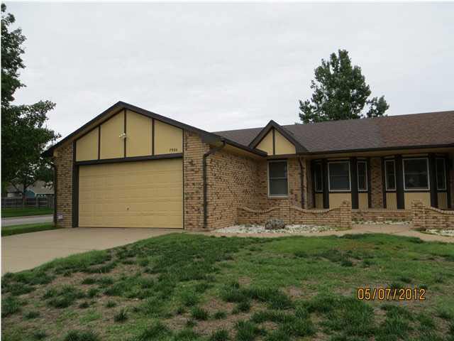 Attractive brick twin home on corner lot
