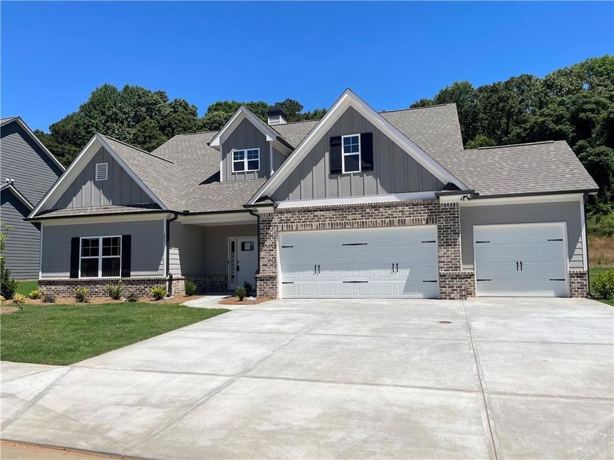 Craftsman-style house with a front yard