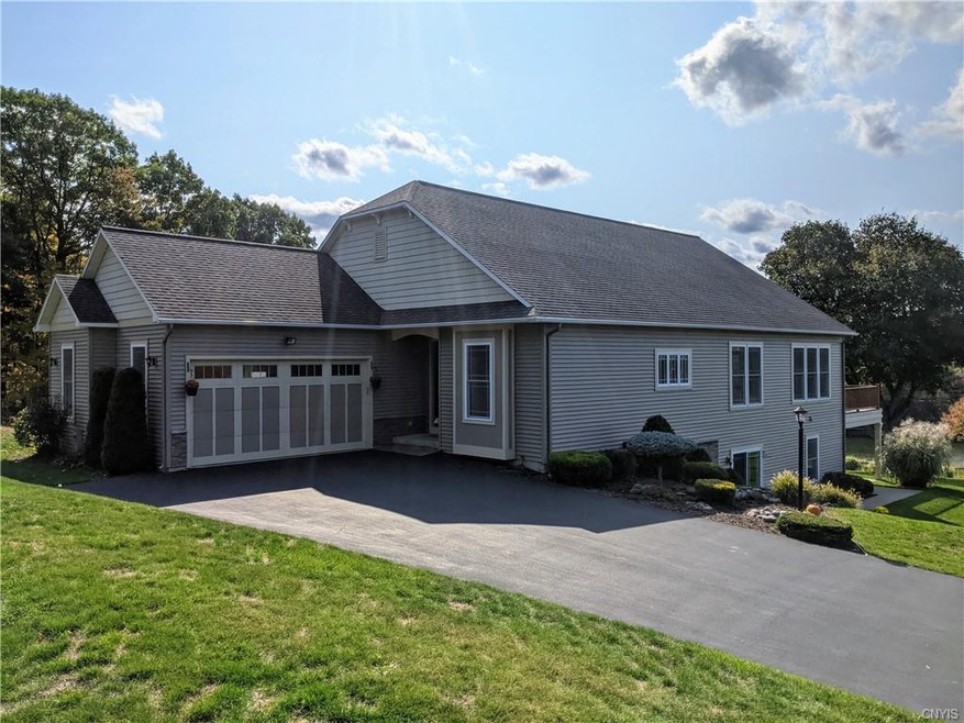 Exterior wide driveway with two car garage & view 