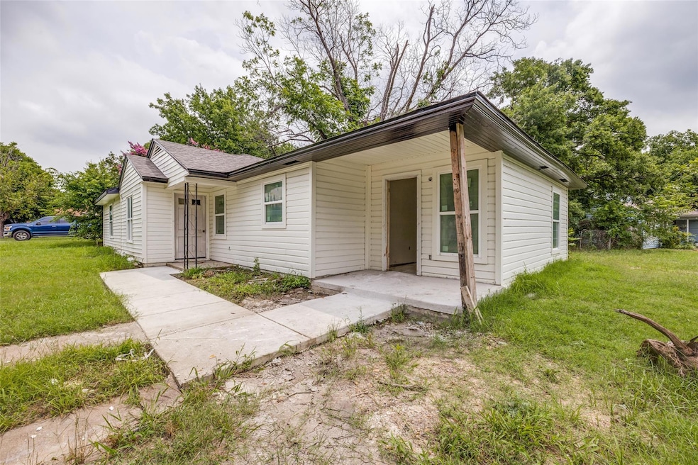 This lovely home sits on a wide corner lot. Owens 