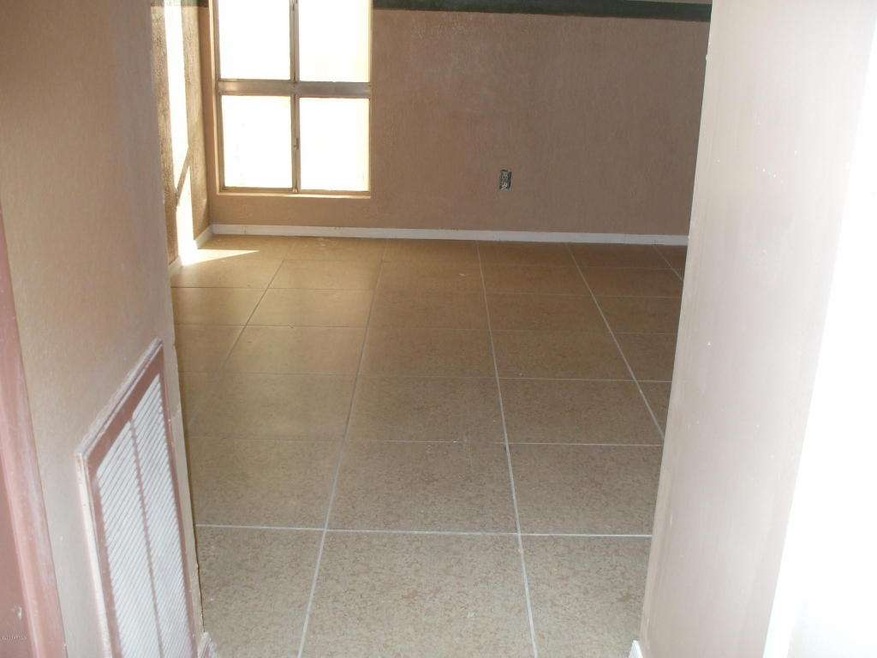 Tiled Bed Room Viewed From Bedrm Door