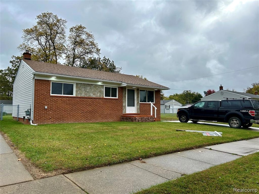 View of front of home featuring a front lawn, brick siding, a shingled roof, and a chimney