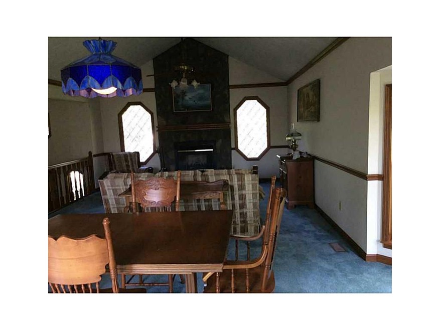 Dining Room. Open to great room and kitchen.  L-sh