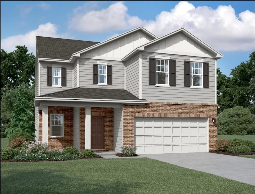 View of front of property featuring an attached ga