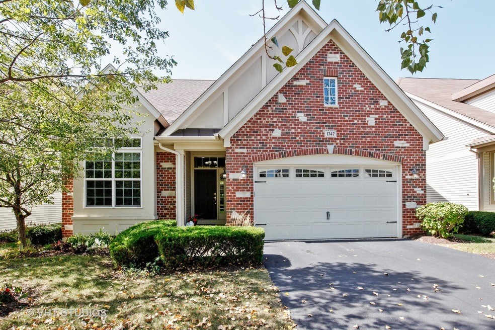 Beautiful Brick & Stone front with welcoming front
