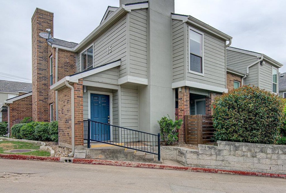 View of home's exterior featuring brick siding an