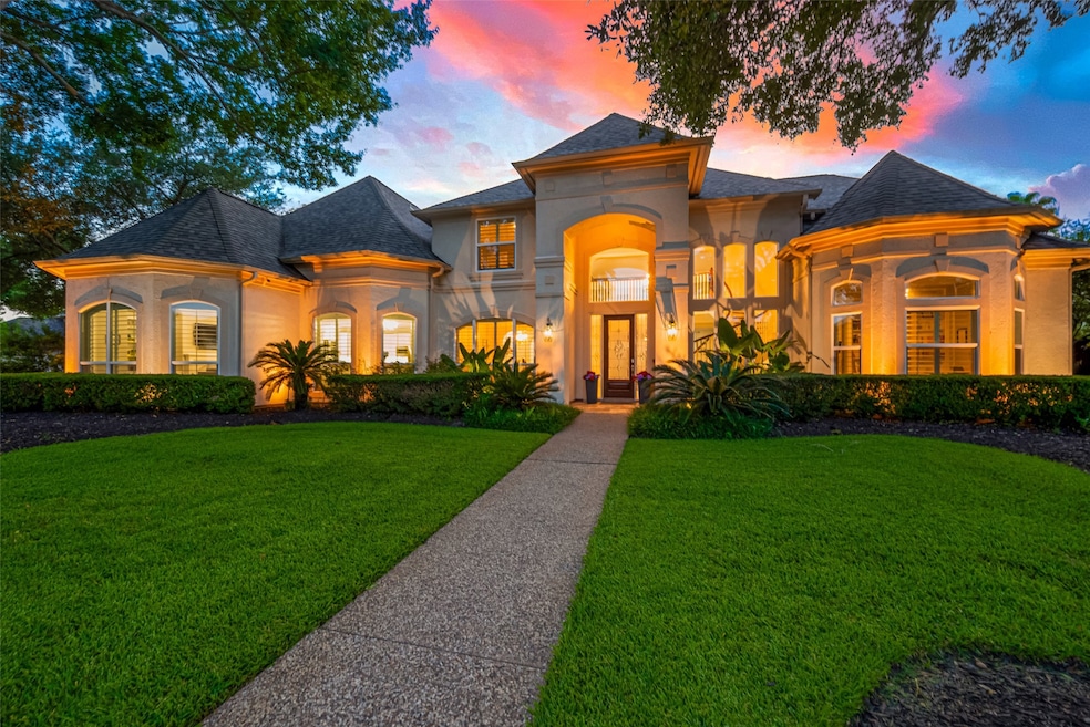 Stunning curb appeal with mature trees, manicured