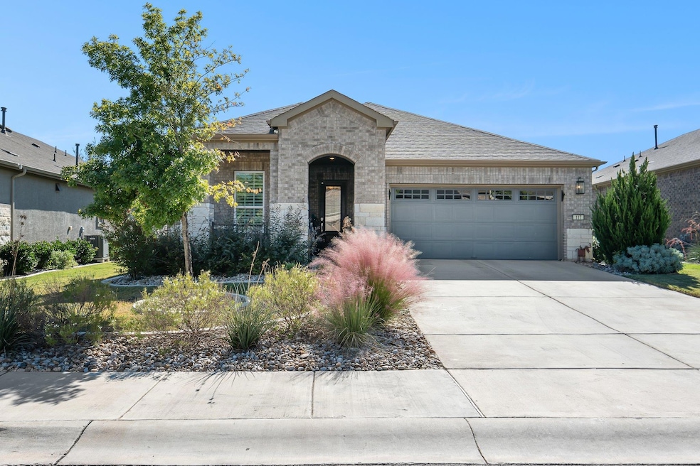 French country style house with brick siding, con