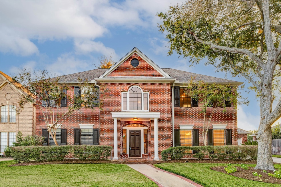 Welcome to Rambling Stone! A classic front door sets the tone for the elegance within, while the impressive two-story façade hints at the 4,152 sq ft of refined living space inside. Located in the coveted Pecan Grove Plantation, this home commands attention from the moment you arrive.