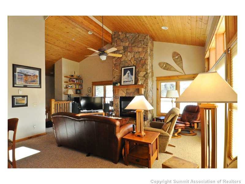 Living Room. Full rock fireplace, vaulted ceilings