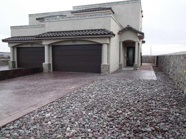 Exterior Front. Cobble stone landscaping