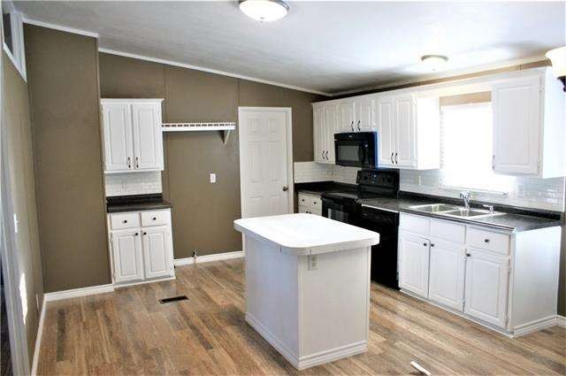 Kitchen with subway tile backsplash.