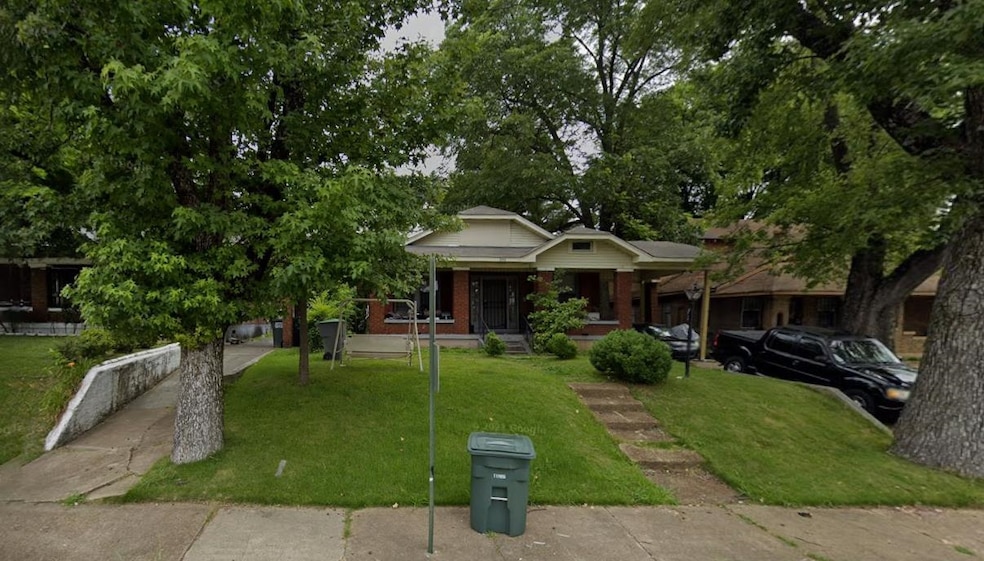 Bungalow-style house with covered porch, a front lawn, and brick siding