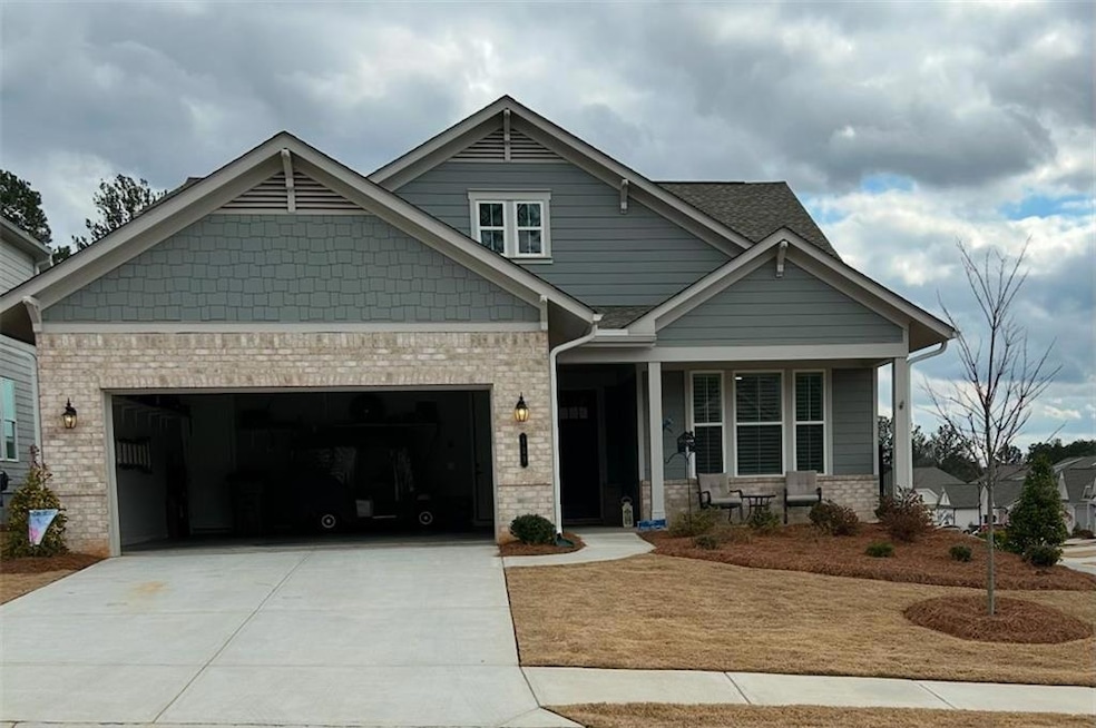 Craftsman house featuring a porch and a garage