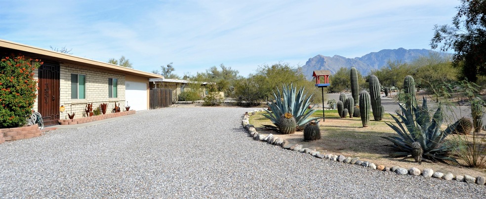 Front of property with mnt view!