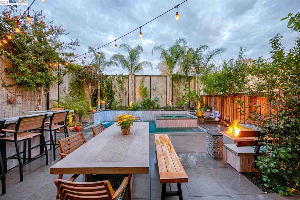 Brilliant design has it all: pool, hot tub, firepit, outdoor kitchen, dog run