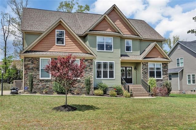 Vinyl Siding, Shakes in Gables, Stone accents, Masonry porch stoop