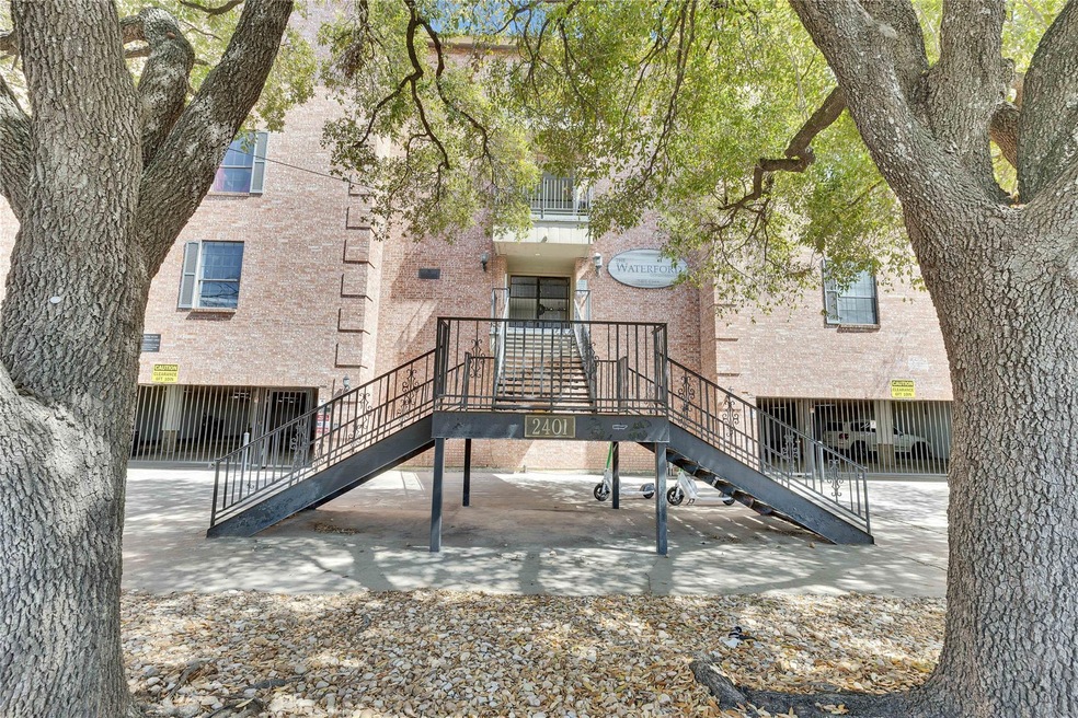 Rear view of property with stairs and a patio area
